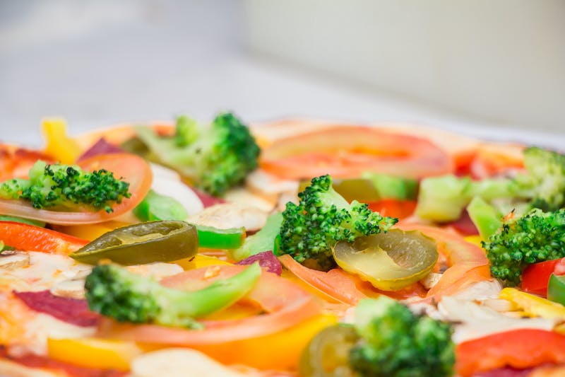 Veggie ranch pizza with colorful fresh vegetables