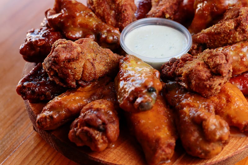 Crispy chicken wings with buffalo ranch sauce